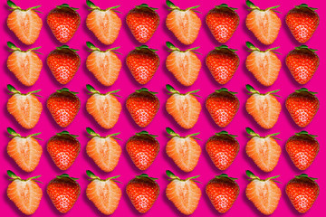 Lots of strawberries on a pink background. Seamless pattern. Strawberry texture