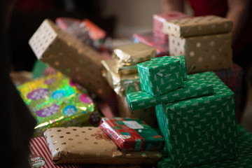 Naklejka na ściany i meble Stacks of Colorfully Wrapped Christmas Gifts