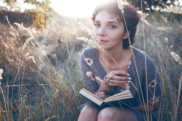 girl reads a book