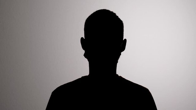 Coronavirus Disease Prevention by Man Covering Mouth with Medical Hygiene Mask