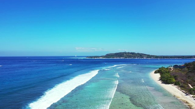 waves washing the shore. aerial Seascape With Coral Reef And Atoll In The Blue Sea Bali, Gilli islands