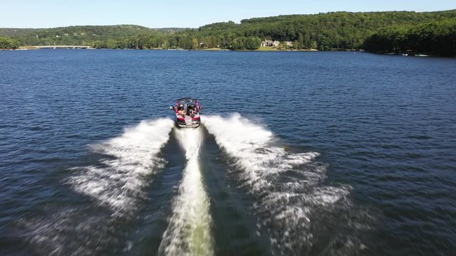 Walkaround boat gliding Deep Creek Lake freshwaters, aerial