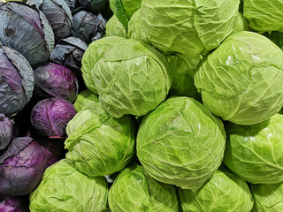 Fototapeta na wymiar Pile of cabbage of different sorts on Mediterranean market