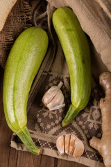 Fresh zucchini and garlic gloves