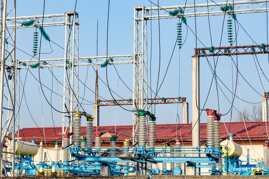 Large electricity circut braker at the sub station. Industrial power transmission through the power line device.