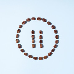 Pause symbol made from coffee beans