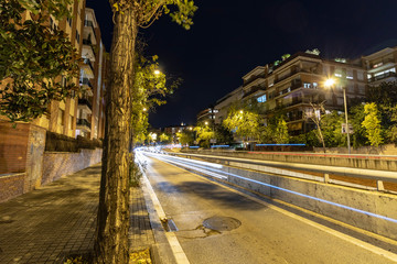 Lights of moving cars, in the city streets at night