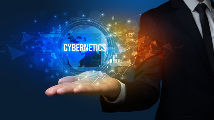 Elegant hand holding CYBERNETICS inscription, digital technology concept