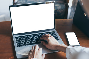 mockup image blank screen computer,cell phone with white background for advertising text,hand woman using laptop texting mobile contact business search information on desk in office.marketing,design