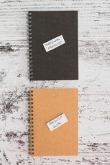 product imitation, Original Product vs Product Dupelabels on similar notebooks in different colors