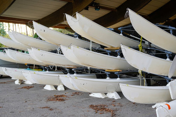sailboat rent canoe rent stored up in shelves on the beach during winter season
