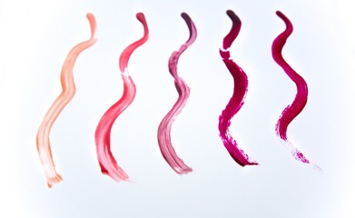 Nail polish isolated on white background. Colorful samples of liquid lipstick. Cosmetics swatches.