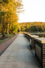 walk along the alleys in the city park along the lake