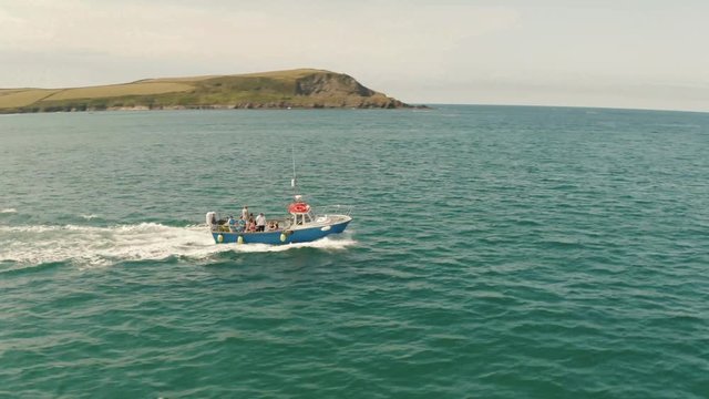 A fishing boat goes out to sea in Cornwall carrying passengers hoping to catch some fish