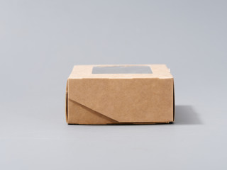 festive cardboard packaging for small gifts on a gray background