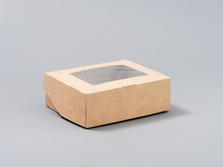 festive cardboard packaging for small gifts on a gray background