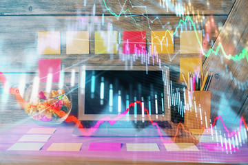 Multi exposure of chart and financial info and work space with computer background. Concept of international online trading.