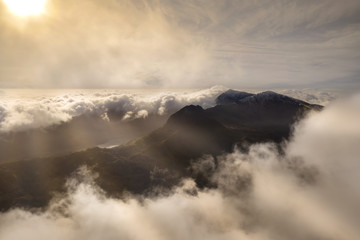 Snowdonia aerial view with low clouds and sunrise, Wales UK