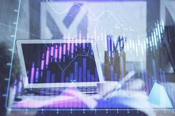 Stock market graph and table with computer background. Multi exposure. Concept of financial analysis.