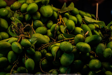 Ripe green guavas  are placed on the fruit stall.