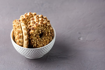Tasty Chips Cookies with Nuts in a White Bowl Gray Background Dessert Horizontal Copy Space