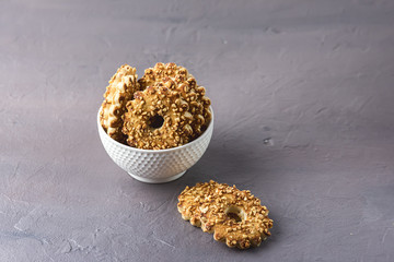 Tasty Chips Cookies with Nuts in a White Bowl Gray Background Dessert Horizontal Copy Space