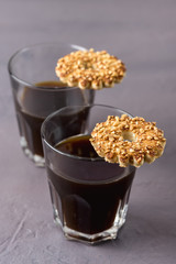 Two Cup of Coffee Americano and Tasty Cookies with Nuts Vertical Gray Background