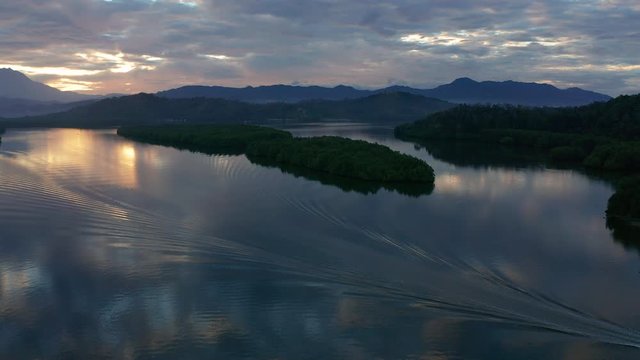 Aerial footage of Beautiful Rural village landscape with green forest in surrounding in Mengkabong River, Tuaran, Sabah, Borneo