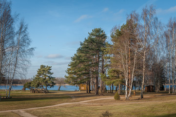 Path to the lake. Walking path by the Varska Resort Center. Estonia. Early spring landscape.