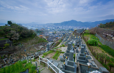 View from the hill to the old Japanese cemetery. Against the backdrop of mountains and sea. Kure Island