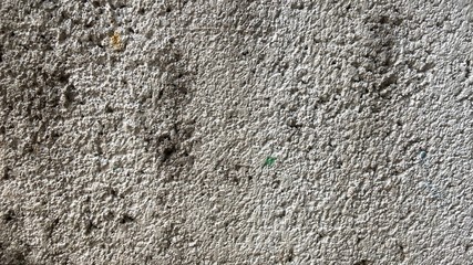 background, pattern, and texture of a white cement wall that is dirty