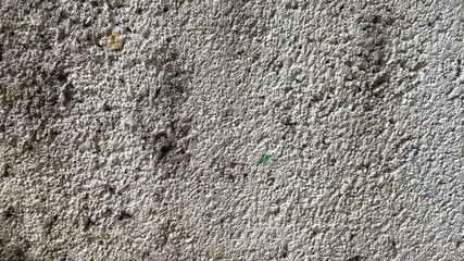 background, pattern, and texture of a white cement wall that is dirty