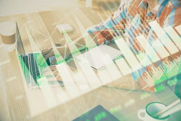 Multi exposure of forex graph with man working on computer on background. Concept of market analysis.