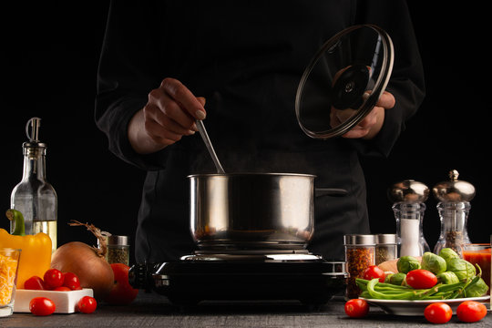 Cooking, the cook prepares pasta with vegetables, and sauce. Culinary and gastronomy.