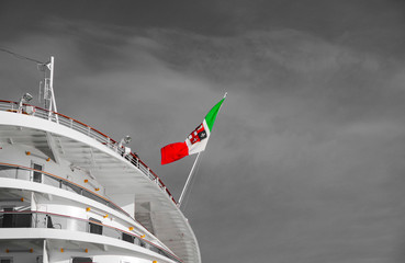 Italian national flag or banner on modern cruise ship or cruise ship liner