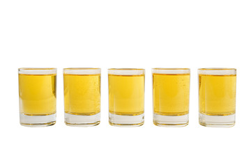 Yellow, same color opaque cocktails, a set of shots in one row, five servings. Side view Isolated white background. Drink for the menu restaurant, bar, cafe