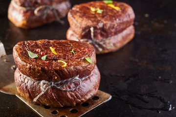 Seasoned grilled thick fillet steak medallion