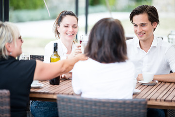Group of friends drinking wine in a winery