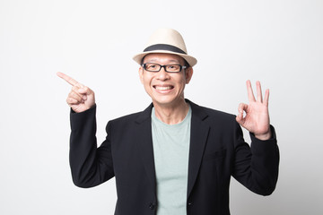 an adult asian man  point and show OK.