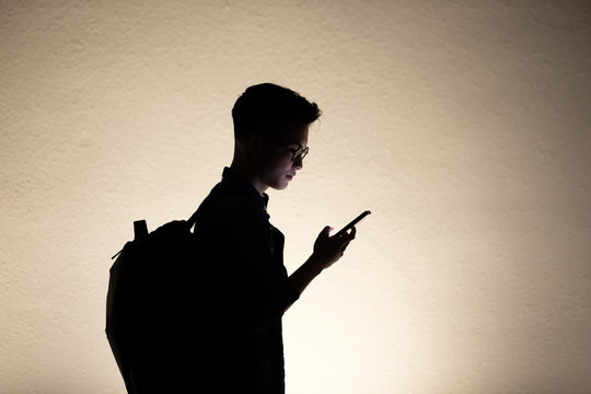 Silhouette Of Man Use Phone