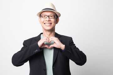 adult asian man  show heart hand sign.