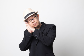 adult asian man with sleeping gesture.