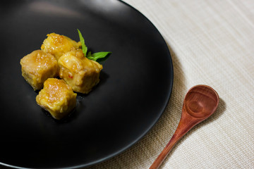 Pork dumplings wrapped in a yellow dumpling sheet