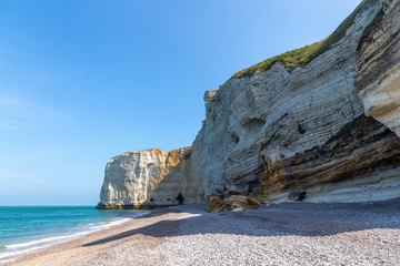 Rocks on the coast of the English channel strait. Etretat village, Normandy region, France.