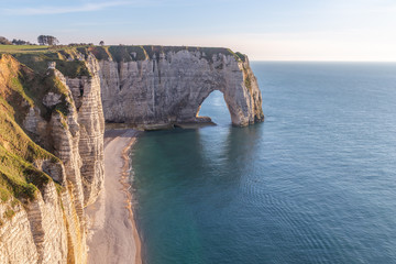 Rocks on the coast of the English channel strait. Etretat village, Normandy region, France.