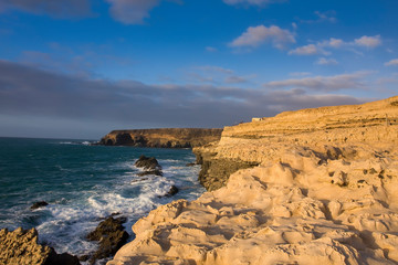 Fototapeta na wymiar Rock formations, limestone rocks on the cliffs near the fishing village of Ajuy, Fuerteventura, Canary Islands, Spain, Europe
