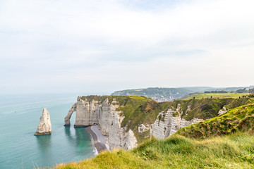 Rocks on the coast of the English channel strait. Etretat village, Normandy region, France.