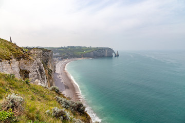 Fototapeta na wymiar Rocks on the coast of the English channel strait. Etretat village, Normandy region, France.