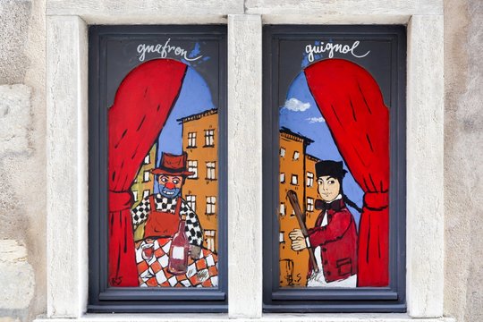 Lyon, France - October 12, 2016: Guignol puppet on a window. Guignol is the main character in a French puppet show which has come to bear his name. Guignol is a symbol of Lyon
