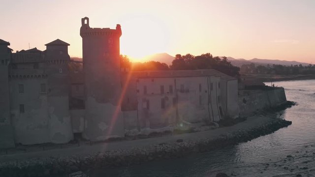 Santa Severa Beach and Castle at sunrise, Province of Rome, Italy. Aerial drone view